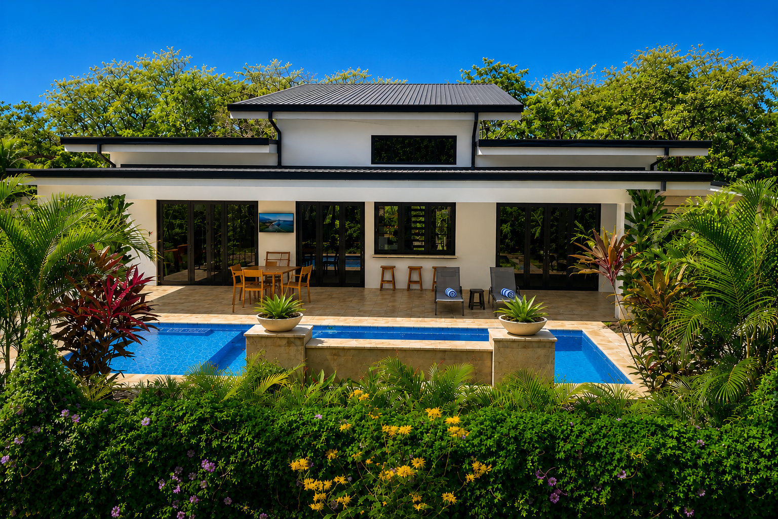 Casa Tranquila exterior with tropical landscaping and private pool